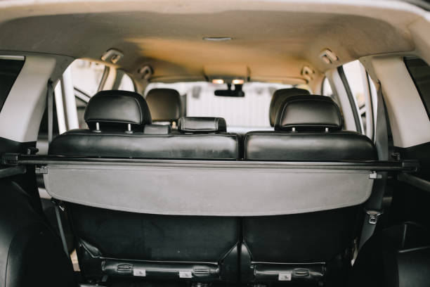 istock Man cleans car interior with vacuum cleaner 1191703842