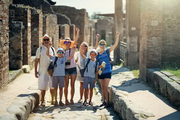 Photo of Multi generation family sightseeing ancient ruins