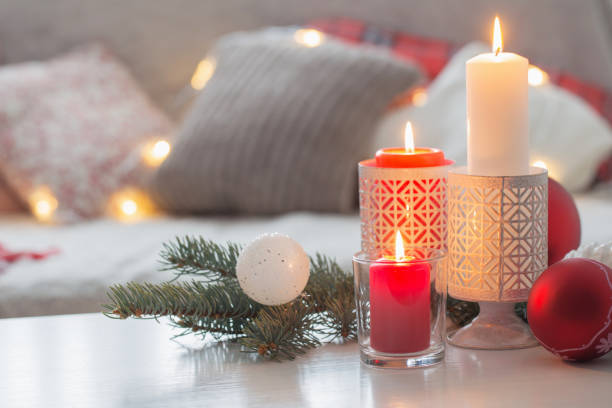 istock Christmas decora with candles and balls on white table indoor 1191707140