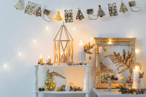 istock Christmas golden decor in white interior 1191707185