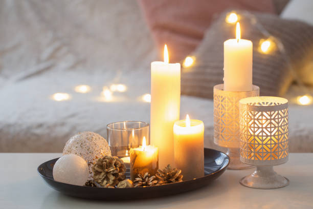 istock Christmas decoration   with burning candles on  white table agai 1191707246