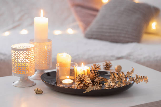 istock Christmas decoration   with burning candles on  white table agai 1191707248