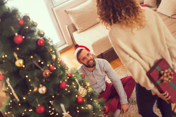 istock Couple exchanging Christmas presents 1191710348