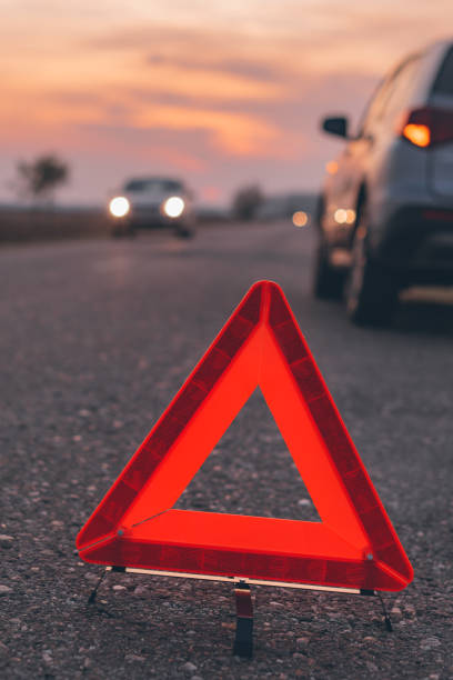 istock Warning triangle sign on the road in sunset 1191714750