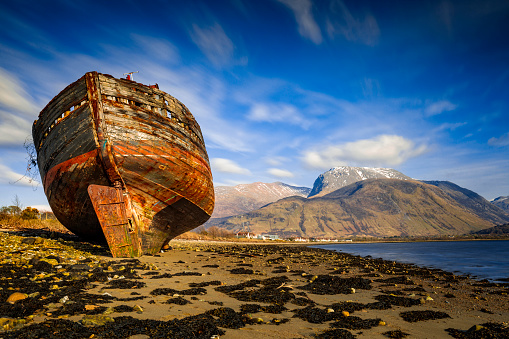 old wreck at Corpach near Fort William in Scotland with the Ben Nevis in the background