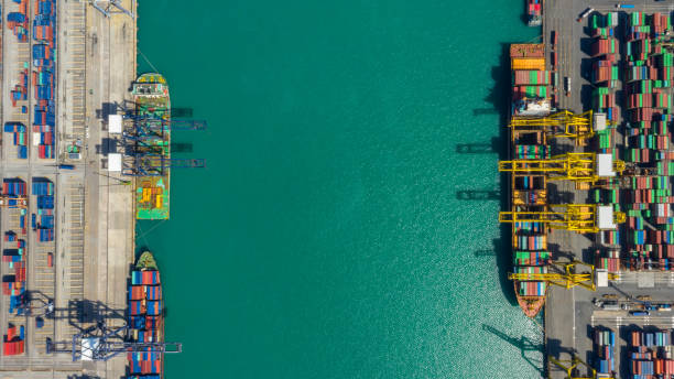 istock Container ship in export and import business logistics and transportation. Cargo and container box shipping to harbor by crane. Water transport International. Aerial view and top view. 1191721222