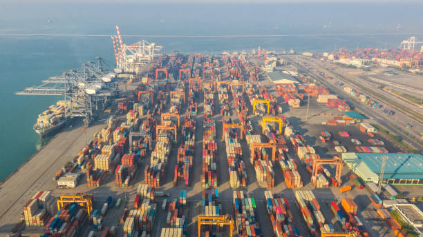 istock Container ship in export and import business logistics and transportation. Cargo and container box shipping to harbor by crane. Water transport International. Aerial view and top view. 1191721355