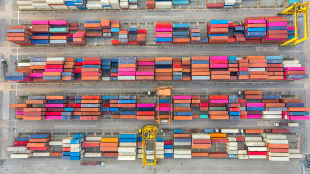 istock Container ship in export and import business logistics and transportation. Cargo and container box shipping to harbor by crane. Water transport International. Aerial view and top view. 1191721395