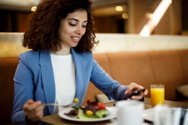 istock Businesswoman having breakfast in restaurant 1191721579