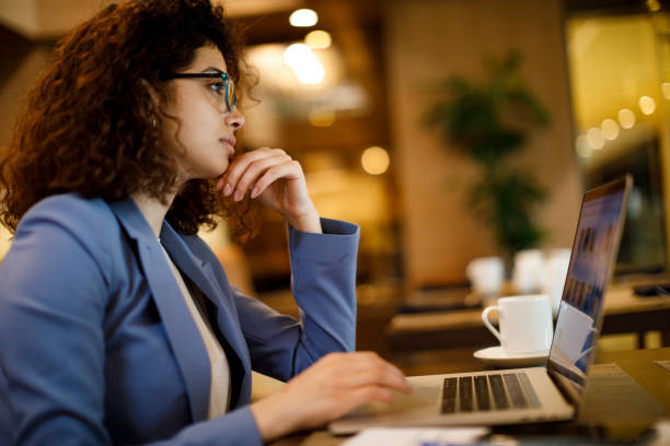 istock Thoughtful businesswoman looking away and thinking of problem solution at a cafe 1191722721