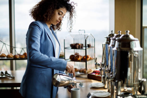 Businesswoman having coffee break at business meeting Businesswoman having coffee break at business meeting buffet hotel people women stock pictures, royalty-free photos & images