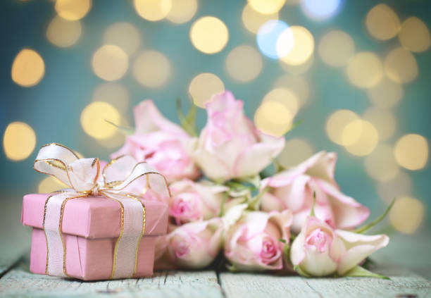 istock rose flower on wooden background and bokeh 1191723084