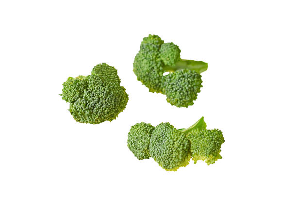 istock Three branches of fresh green broccoli isolated on white background without shadow. Close-up 1191724476