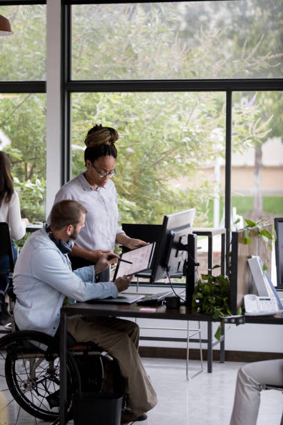 istock Business colleagues discuss financial data 1191725525