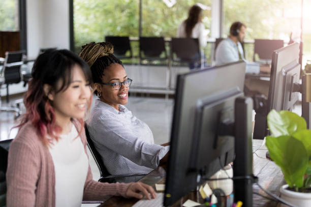 istock Cheerful female colleagues working together 1191725531
