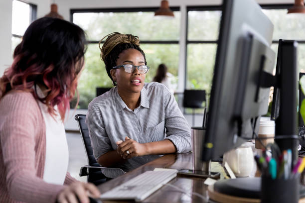 istock Businesswomen discuss project ideas 1191725533