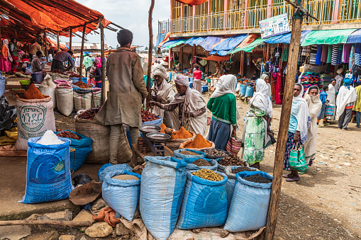 Ethiopia. Amhara. Debark. September 21, 2019. Man selling spices at the market in Debark.