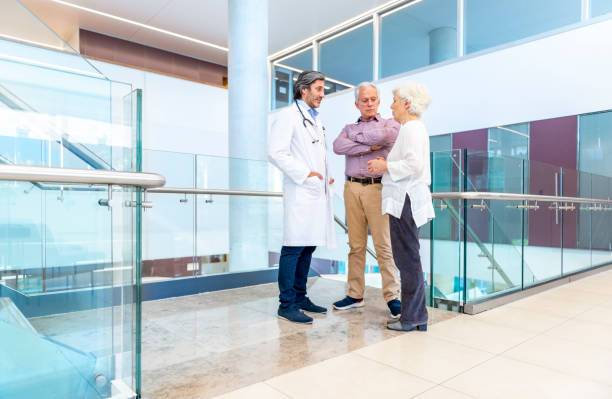 istock Doctor talks with a senior couple 1191726334