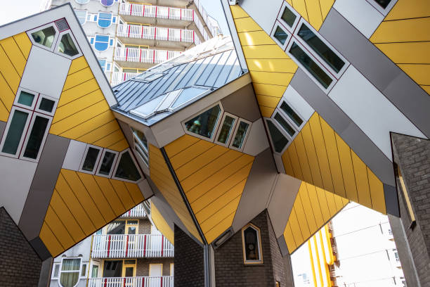 Rotterdam, Netherlands - November 17th, 2019: The Cube Houses in Rotterdam by Piet Blom. Photographed from below in sunlight.