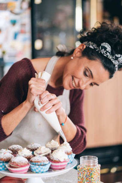 istock Confectioner decorating Chocolate Muffins 1191729887