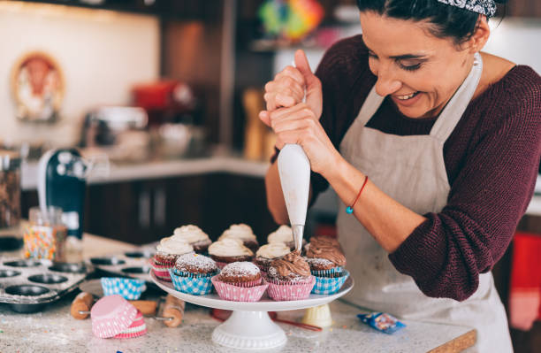 istock Confectioner decorating Chocolate Muffins 1191729902