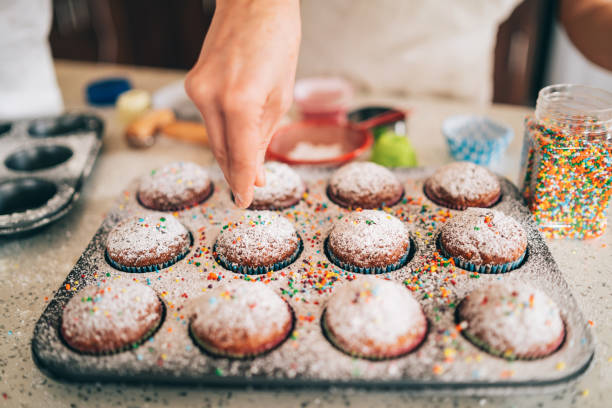 istock Confectioner decorating Chocolate Muffins 1191729907