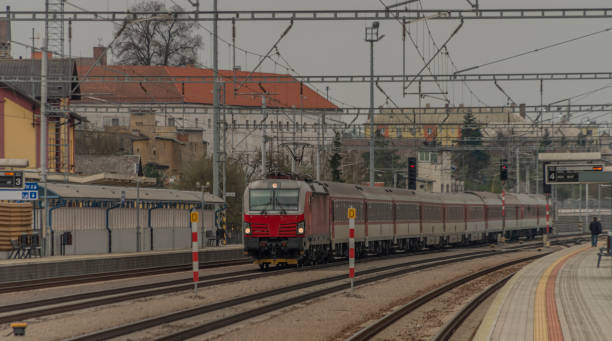 istock Fast passenger train with red modern electric engine in Ilava station 1191730459