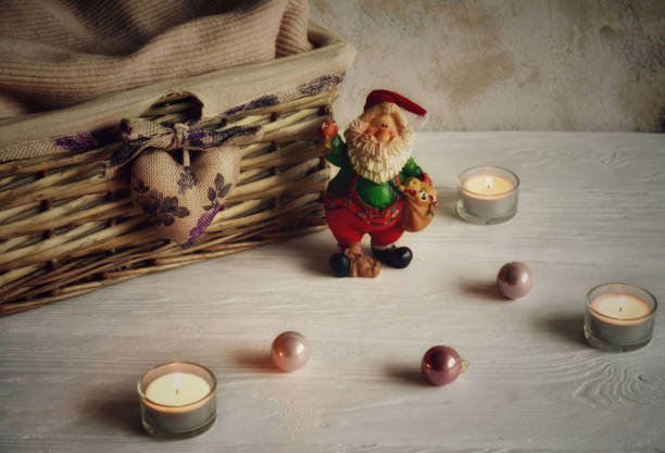 istock Festive background with basket, candles and Christmas decorations. 1191731432
