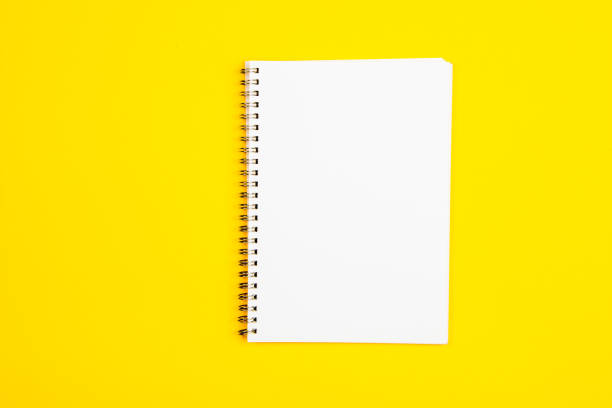 istock Empty white paper page on a yellow background 1191731862
