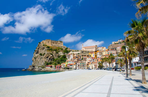 Scilla village, castle on rock and colorful houses, Calabria, Italy Beautiful seaside town village Scilla with old medieval castle on rock Castello Ruffo, colorful traditional houses, Sirens beach on Mediterranean Tyrrhenian sea coast shore, Calabria, Southern Italy castle scilla stock pictures, royalty-free photos & images
