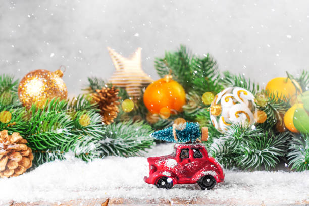 istock Christmas fir tree on a toy car 1191733499