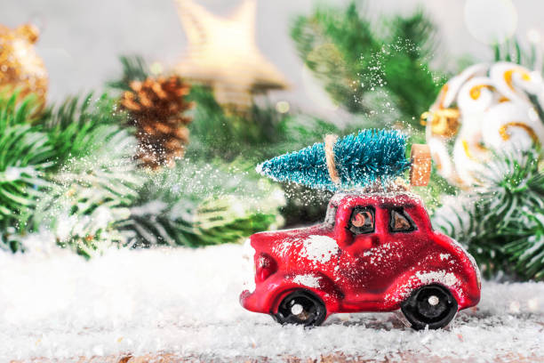 istock Christmas fir tree on a toy car 1191733512