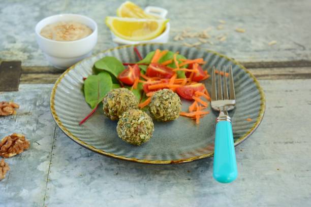 istock Seed falafel balls with vegetable salad and tahini dressing 1191735035