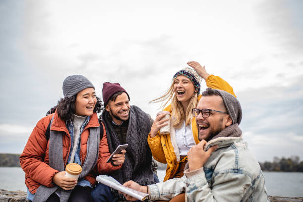 Group of friends having fun by the river