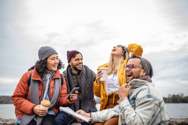 istock Group of friends having fun by the river 1191737639