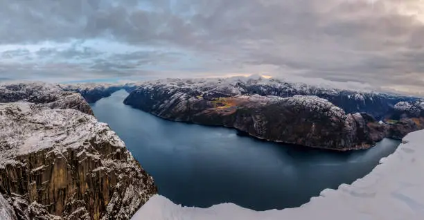 Photo of Panoramic view of Lysefjord from the Preikestolen Pulpit Rock, beautiful colors at sunset, Ryfylke, Rogaland, Norway