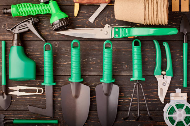 istock Gardening tools on wooden background flat lay 1191740054