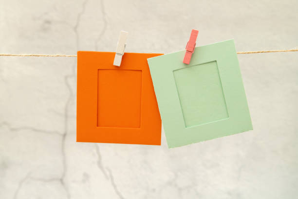 Blank colorful photo frames hanging.