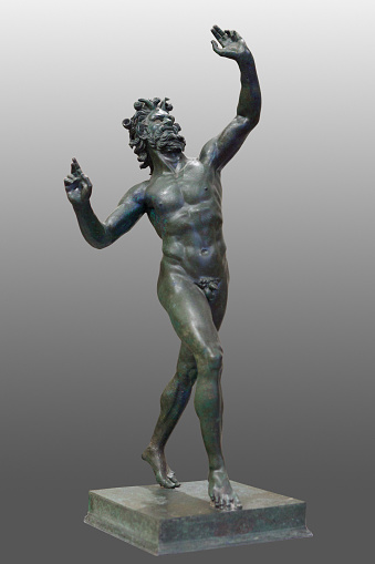 Dancing faun. Roman bronze statue from Pompeii (Pompei), Italy. Isolated with clipping path