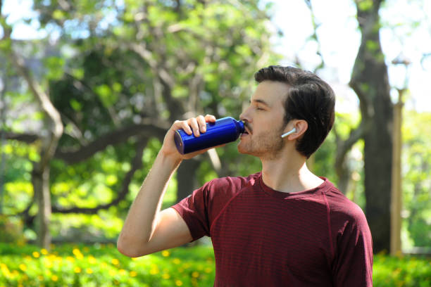 istock young man doing sport in the park 1191741460