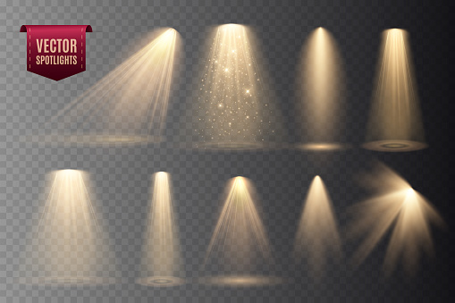 Set of Spotlights isolated on transparent background. Vector glowing light effect with gold rays and beams