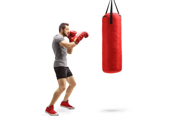 istock Young athlete training box with a punching bag 1191741896