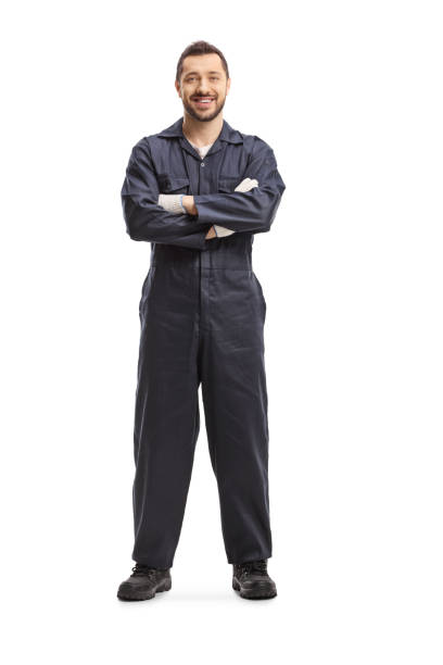 Mechanic in a dark blue overalls Full length portrait of a mechanic in a dark blue overalls isolated on white background jumpsuit stock pictures, royalty-free photos & images