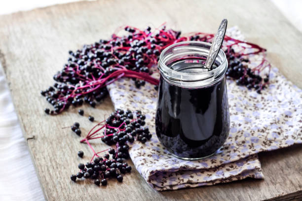 istock Homemade black elderberry syrup in glass jar 1191742721