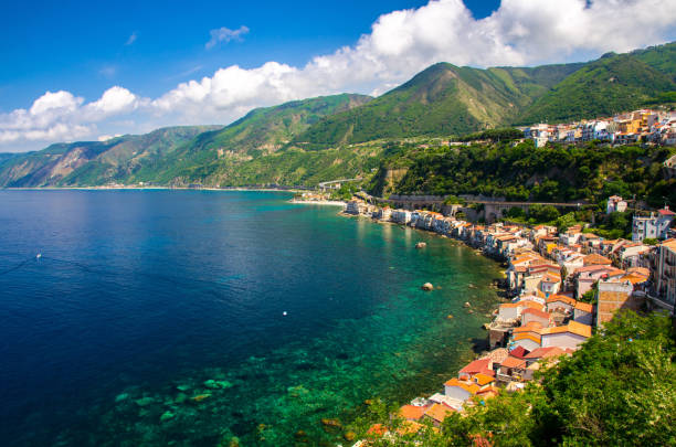 Aerial top view of small fishing village Chianalea di Scilla, Italy Aerial top view of houses in small fishing village Chianalea di Scilla from old medieval castle on rock Castello Ruffo and Mediterranean Tyrrhenian sea coast shore, Calabria, Southern Italy castle scilla stock pictures, royalty-free photos & images