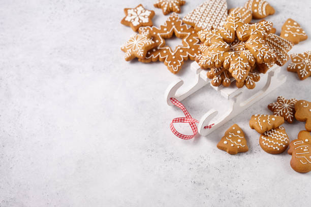 istock Gingerbread cookies on white wooden sledge 1191745399