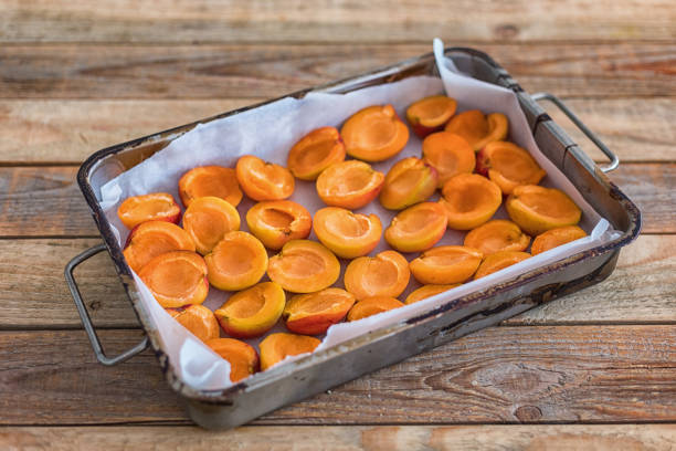 istock Apricot cut into halves in baking tray, close up 1191746513