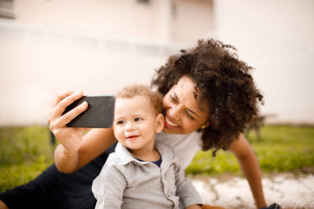 istock mother and son taking selfies 1191751118
