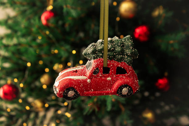 istock Christmas toy red car on a New Year tree. Christmas composition. 1191751243