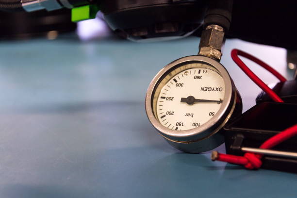 istock Gas pressure indicator, scuba diving oxygen lying on blue table background, copy space 1191751844